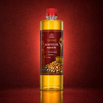 Banaras Foods cold-pressed almond oil bottle on a crimson background