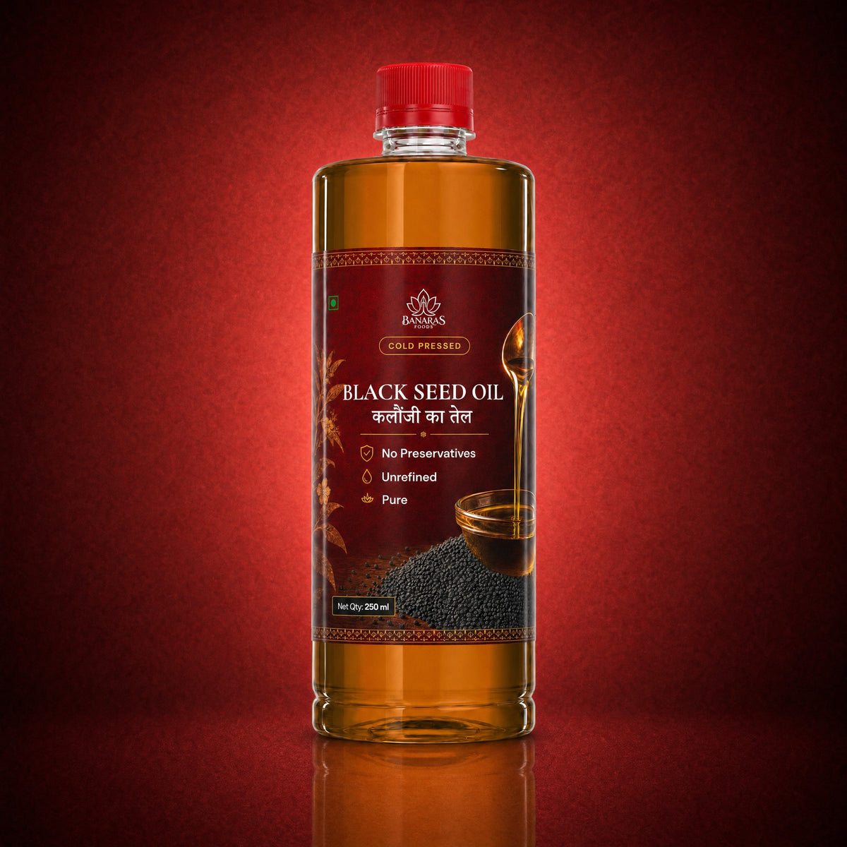Banaras Foods cold-pressed black seed oil bottle on a crimson background