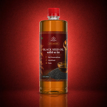 Banaras Foods cold-pressed black seed oil bottle on a crimson background